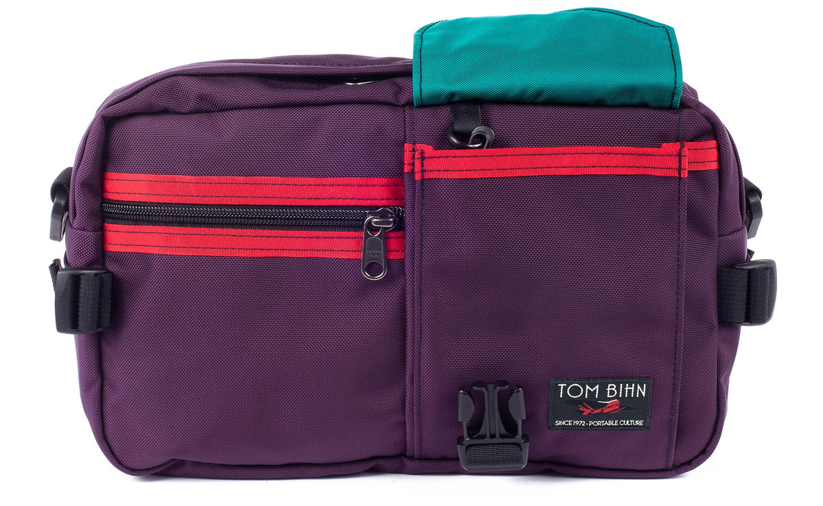 visible variant TB0425-UKVJ^^The LGD in Aubergine/Red/Viridian. Front view of the bag, buckle pocket lifted up showing the Viridian lining.