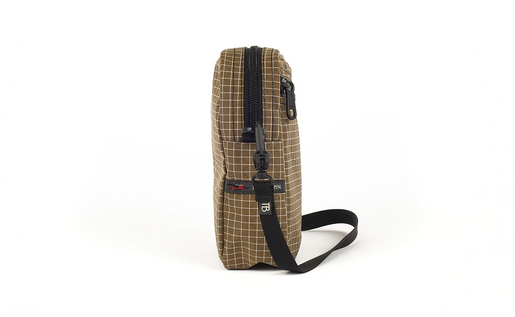 visible variant TB0416-CDNE TB0416-CDLE TB0416-CDGE^^A side view of the Everyday Cubelet in Coyote Halcyon (brown with a white grid) showing the o-ring attachment point and included 5/8" strap.