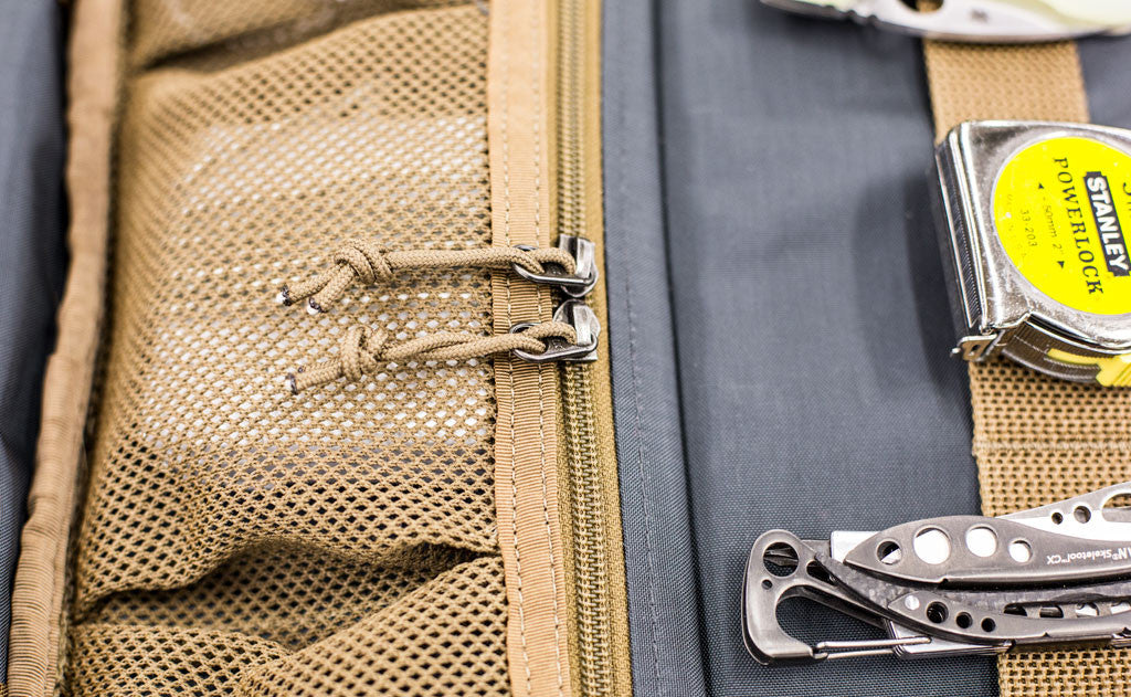 lifestyle visible^^A close shot of the zippered pockets on the interior of the Founder's Briefcase.