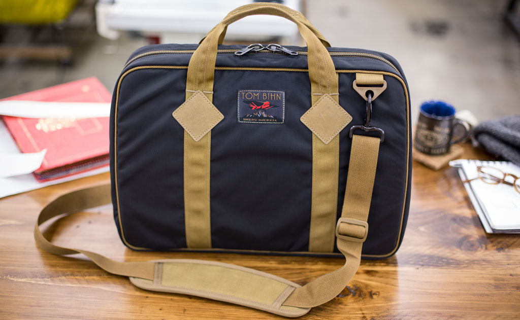 lifestyle visible^^A full Founder's Briefcase sitting upright.