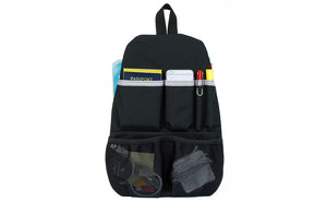 visible variant TB1842-BJ^^ The Black Synapse 19 Freudian Slip, holding a charger, cables, passport, pens, and a phone.