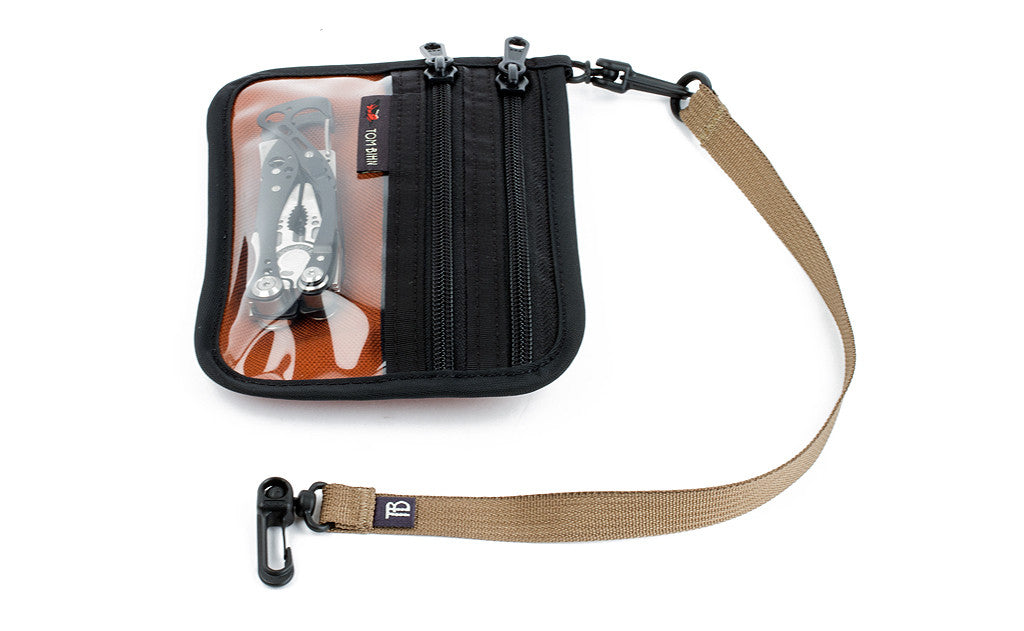 visible variant TB0516-BA TB0516-CA TB0516-ND TB0516-SD TB0516-UD TB0516-WD TB0516-ID TB0516-PA TB0516-ZA^^A 16-inch Key Strap with a snaphook at one end and an o-ring at the other attached to a Double Organizer Pouch.