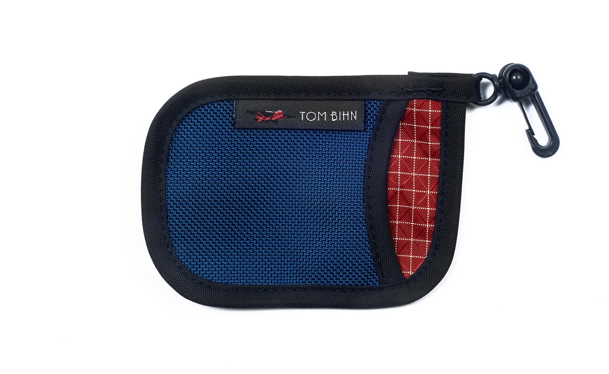 visible variant TB1229-NBID^^A Pocket Pouch in Navy with a Iberian interior.