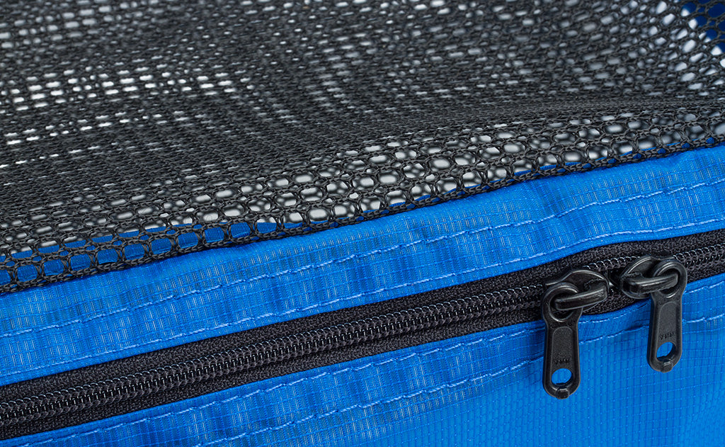detail visible^^The zipper and mesh top on a Western Flyer Packing Cube in Island (blue) 120 Aether.