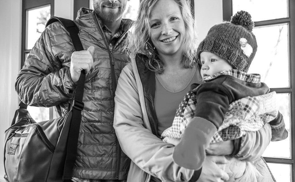 A person shoulder-carrying a Parental Unit.