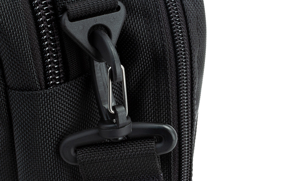 A close shot of the snaphook attachment point with a snaphook attached.