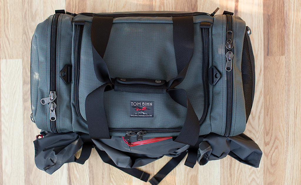 lifestyle visible^^The Road Buddy Lash Straps holding a jacket.