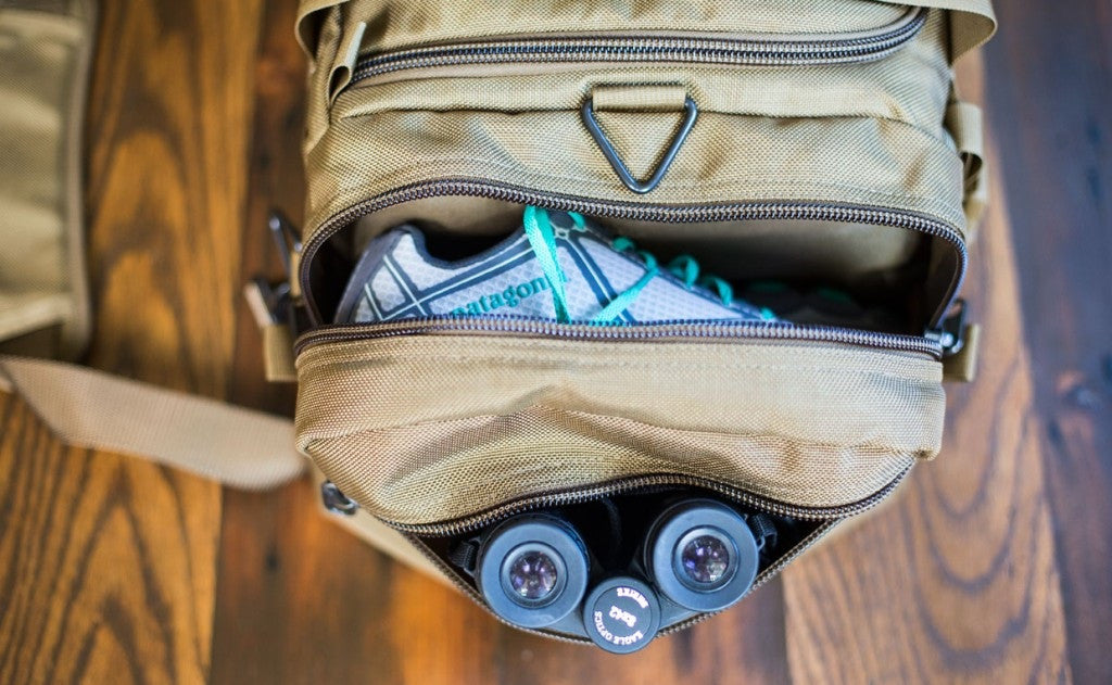 lifestyle visible^^A close shot of the end pocket and side pocket open on a Medium Road Duffel.