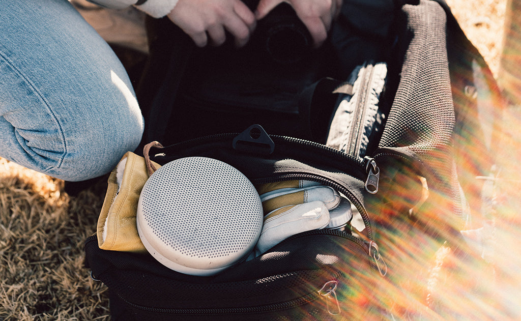 lifestyle visible^^A person accessing the Road Buddy Duffel 60's main compartment.