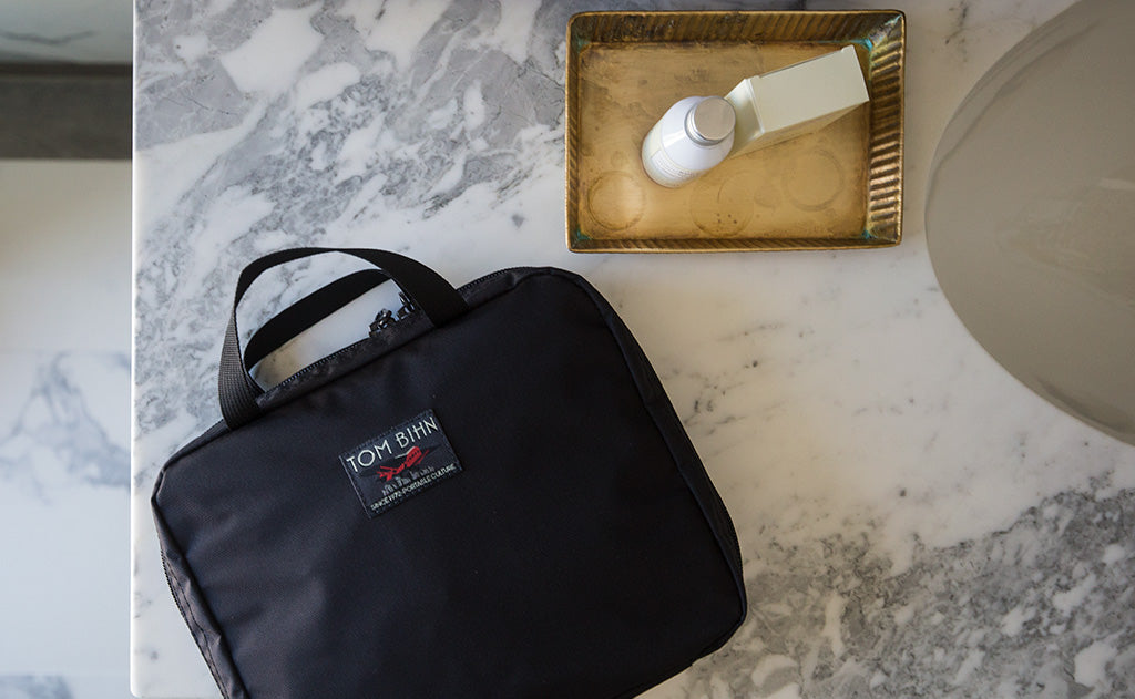 lifestyle visible ^^The Deluxe Spiff Kit on a hotel restroom counter.