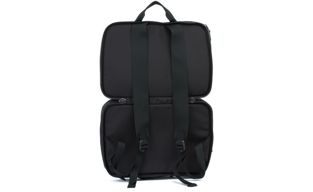 visible variant TB0975-BKLJ^^The Stowaway in Black 525 Ballistic with its main compartmant opened to access the backpack straps.