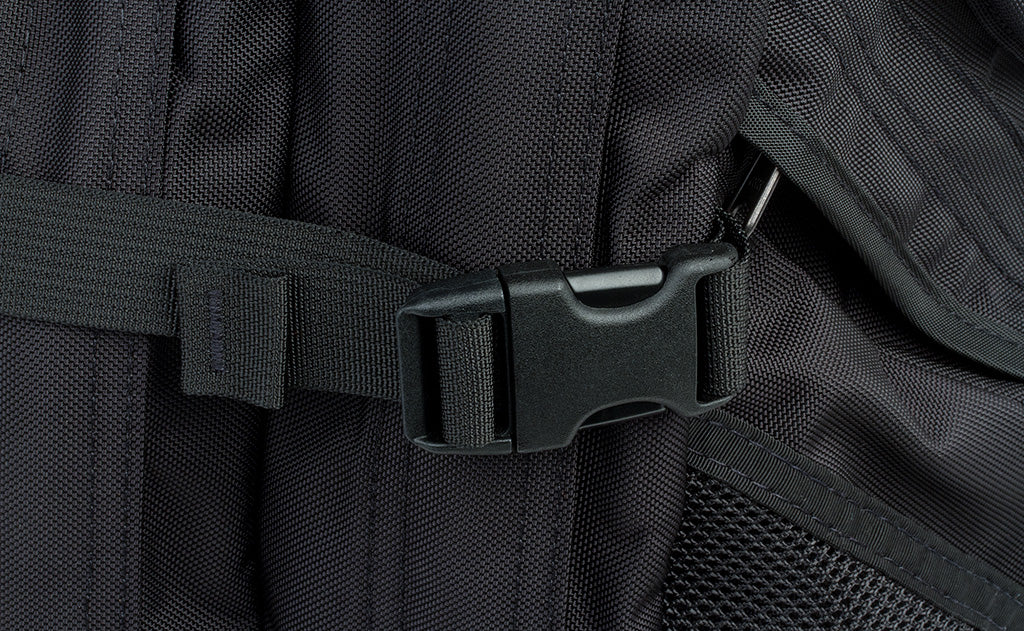 A close shot of one of the side cinches buckled up and cinched down.