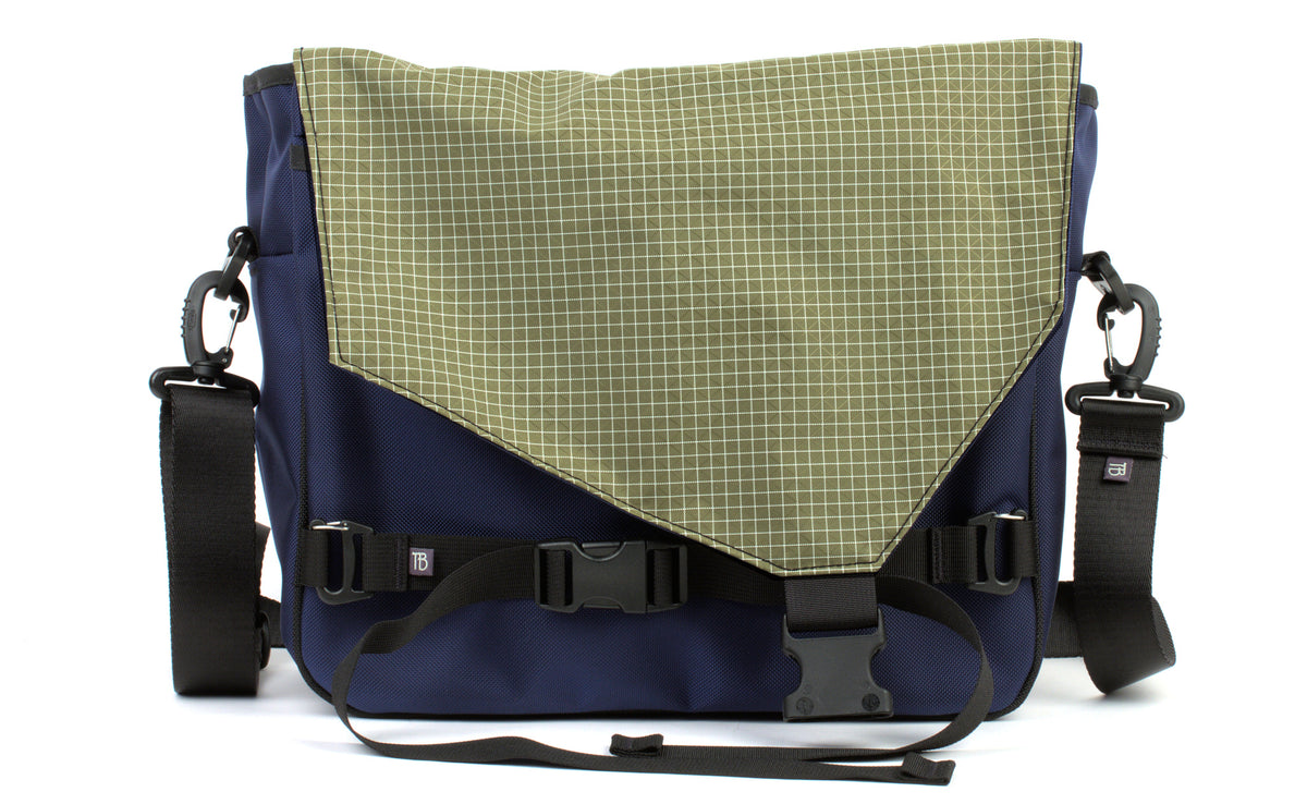 visible variant TB0204-DK8D^^The Maker's Bag in Deep Blue (dark blue) 525 Ballistic with Taiga (olive green with white grid) 200 Halcyon interior.