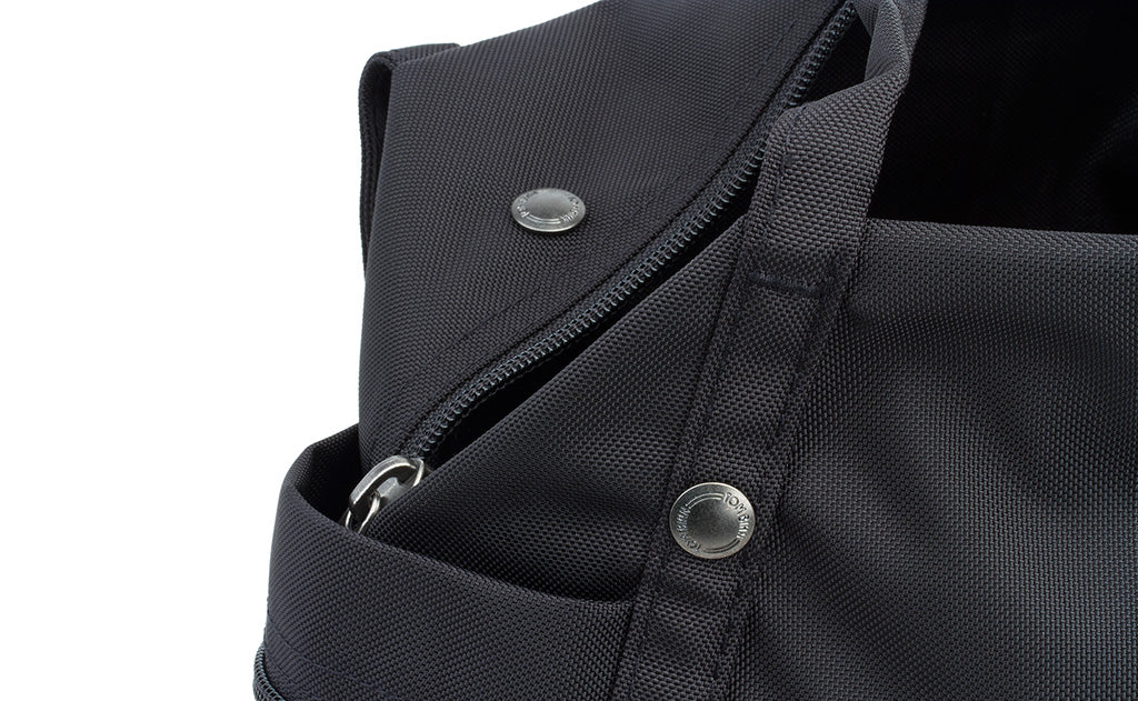 ^^A close shot of the metal snaps and zipper on the Pop Tote.