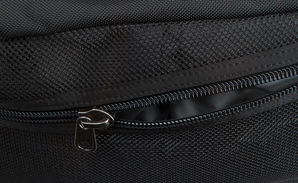 visible detail^^An close shot of the zipper on the mesh side compartment of the Road Buddy Duffel