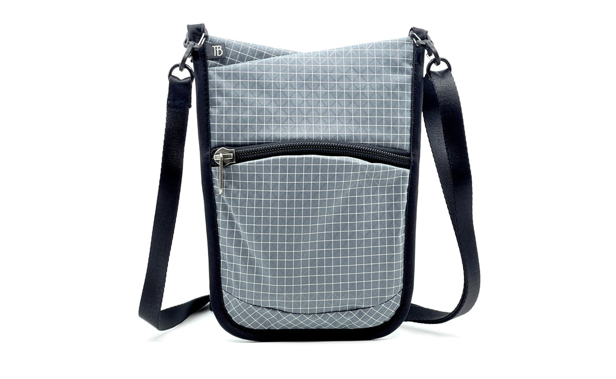 visible variant TB0930-ND^^The front of the P.I.K.A. Pouch in Northwest Sky (light grey with white gridding) 200 Halcyon.