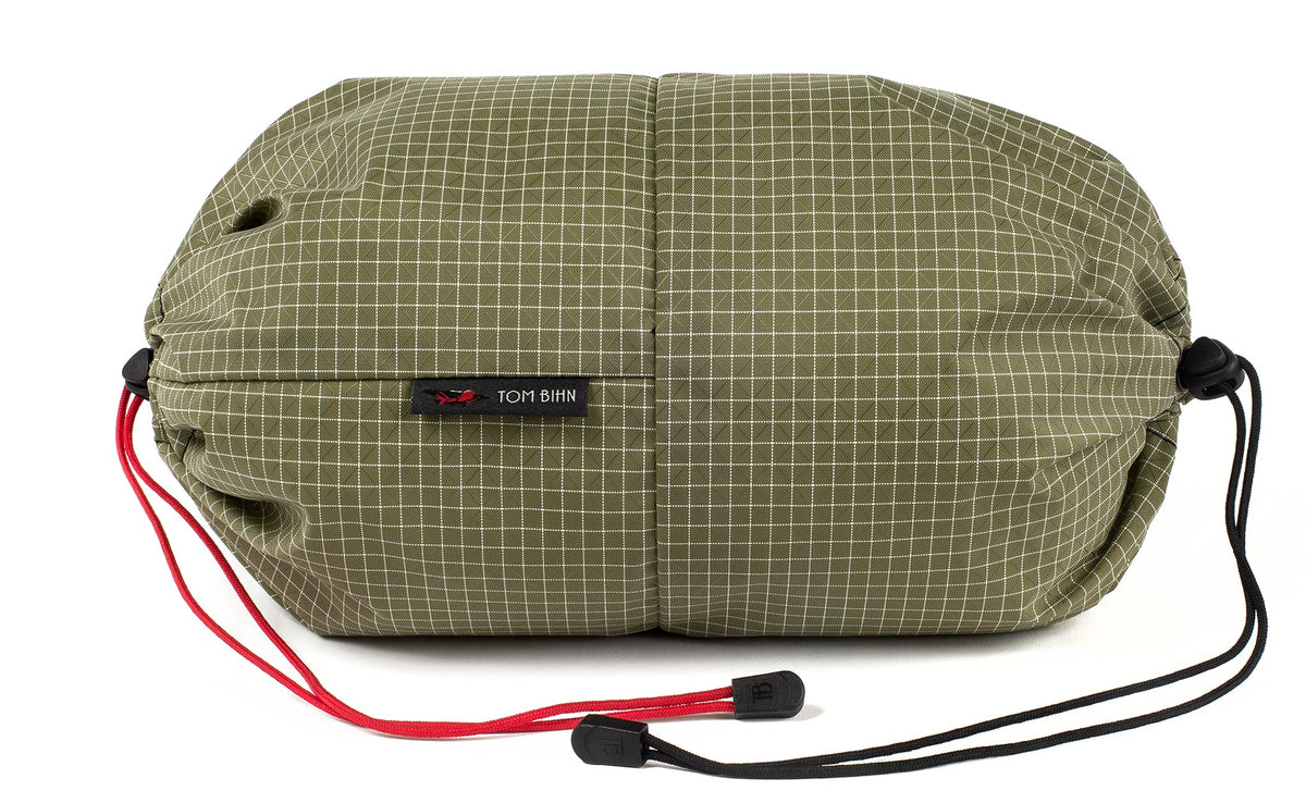 visible variant TB09376-8D^^An Aeronaut 45 Travel Laundry Stuff Sack in Taiga (olive green with white grid) 200 Halcyon.