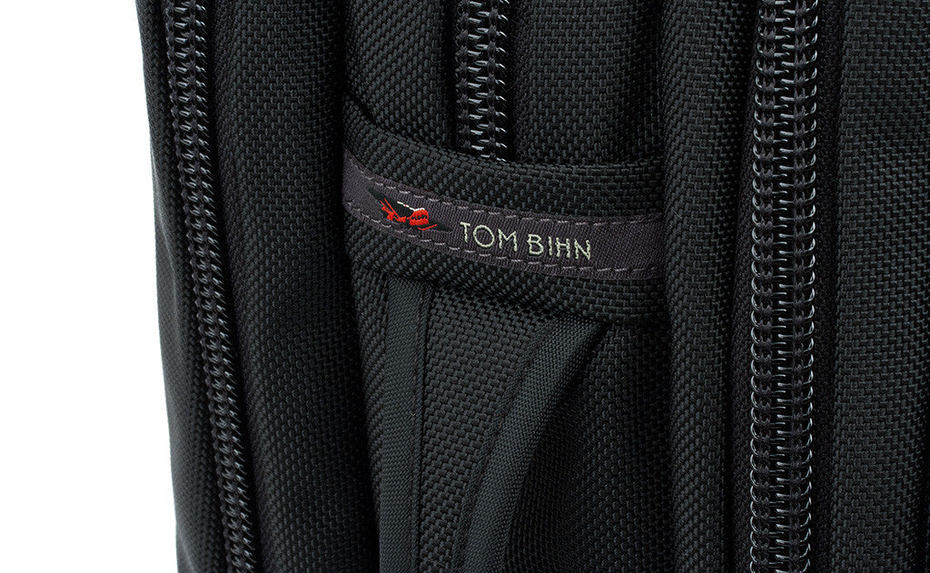 A close shot of the side grab handle and the TOM BIHN tag.