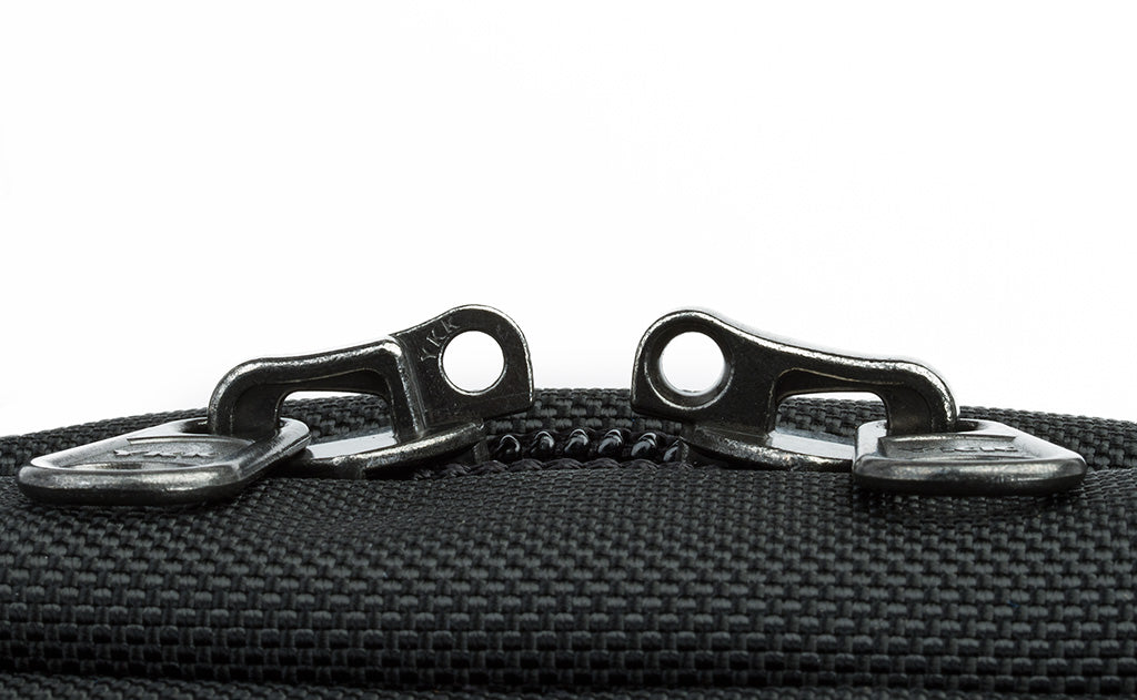 The locking zippers on a Black 525 Ballistic Western Flyer separated to show the individual openings on each of the two zippers.