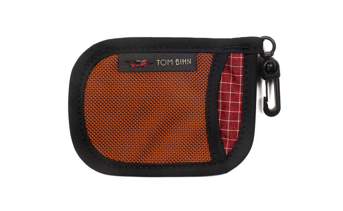 visible variant TB1229-TBID^^A Pocket Pouch in Burnt Orange with a Iberian interior.