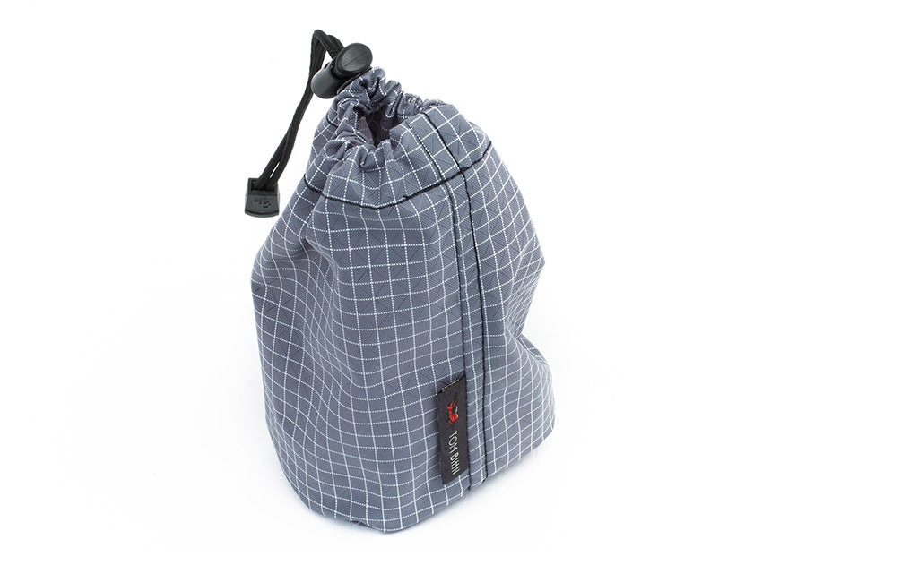 detail visible^^A Size 1 Northwest Sky (light grey with white grid) 200 Halcyon Travel Suff Sack cinched shut.