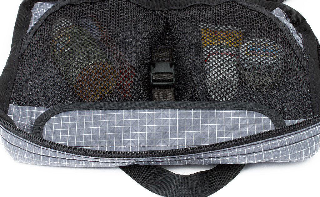 visible detail^^A close shot of the Deluxe Spiff Kit's mesh pockets filled with toiletries.