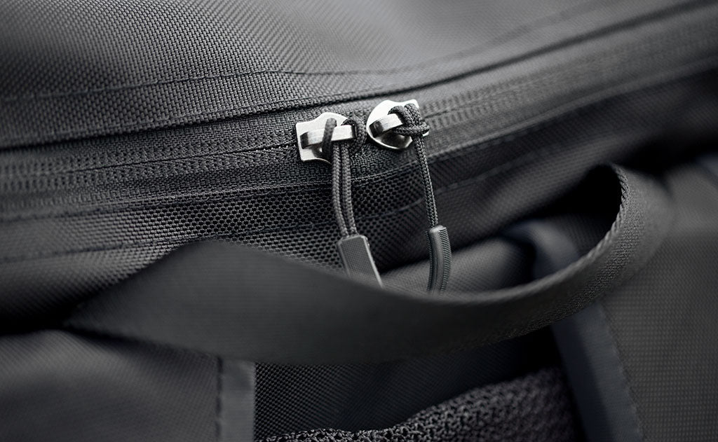 detail visible^^Close-up of the top pocket zipper on the Shadow Guide; we've cut the metal pulls off and have replaced them with cord pulls so you don't have to.