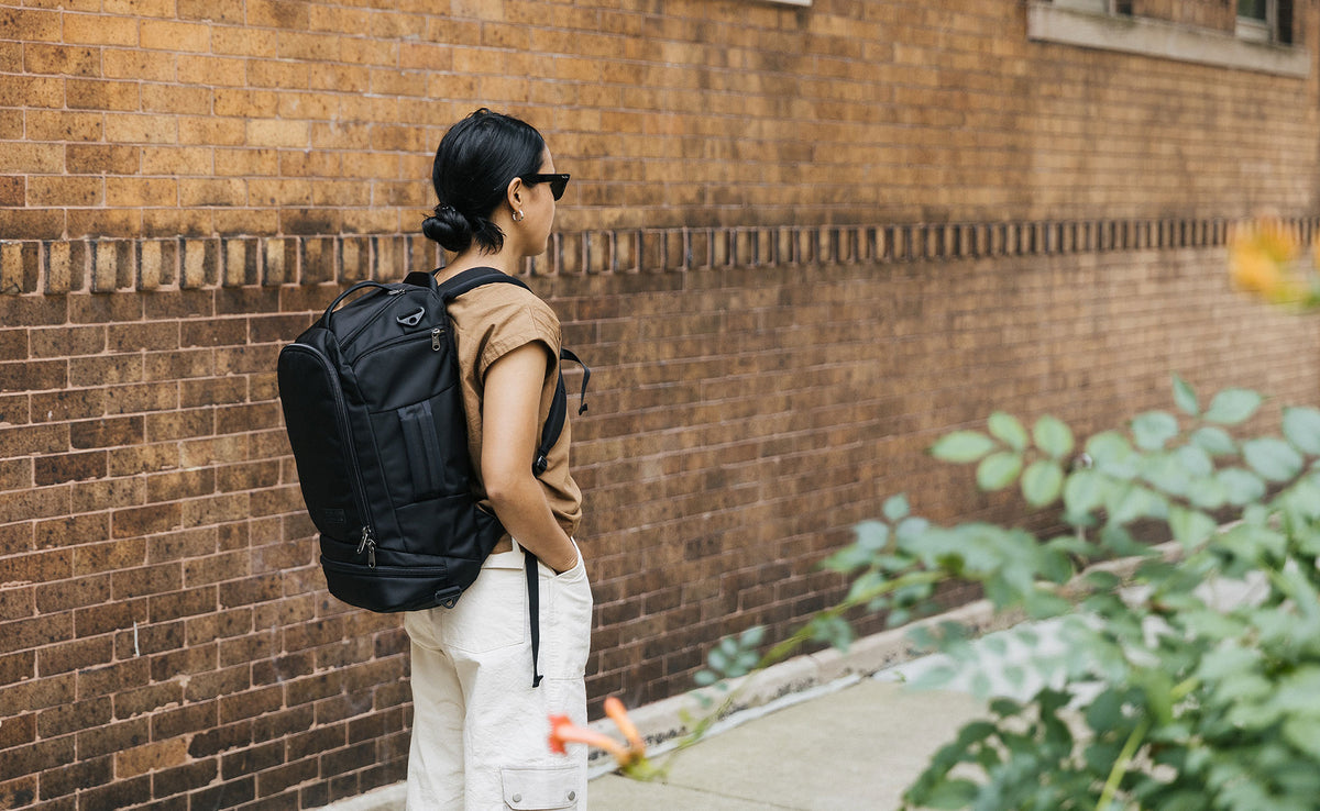 A person wearing the Techonaut 30 as a backpack.