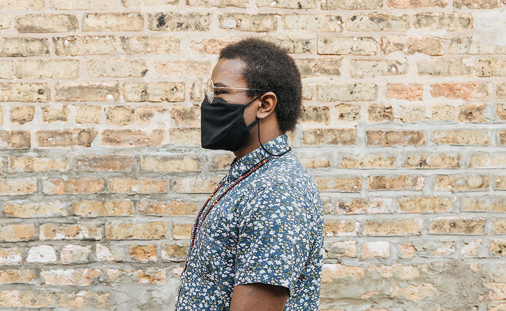 visible variant ME00009-BF^^Person wearing the V4 Mask in 100% Cotton Flannel; background is a brick wall.
