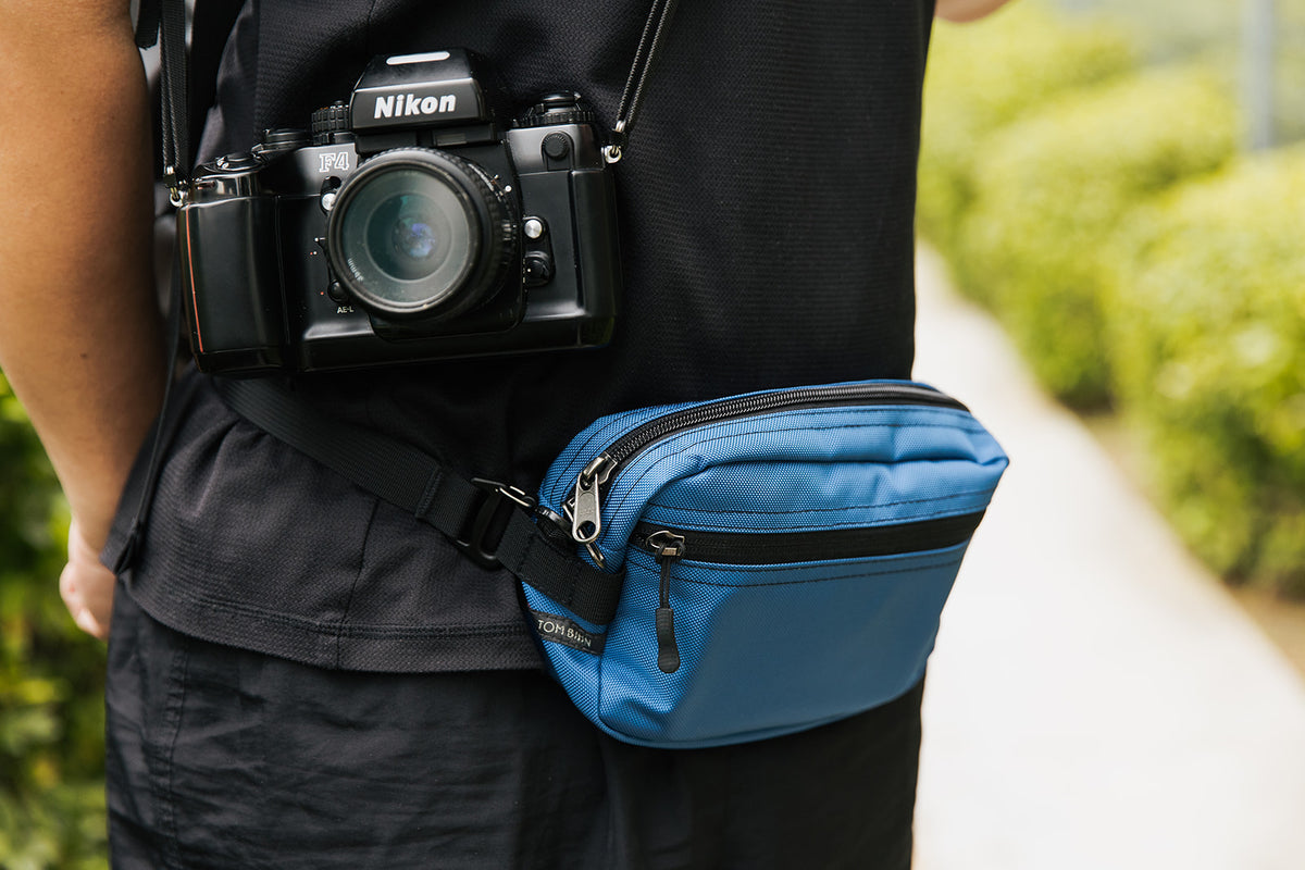 lifestyle visible^^Person wearing the Side Effect as a hip bag