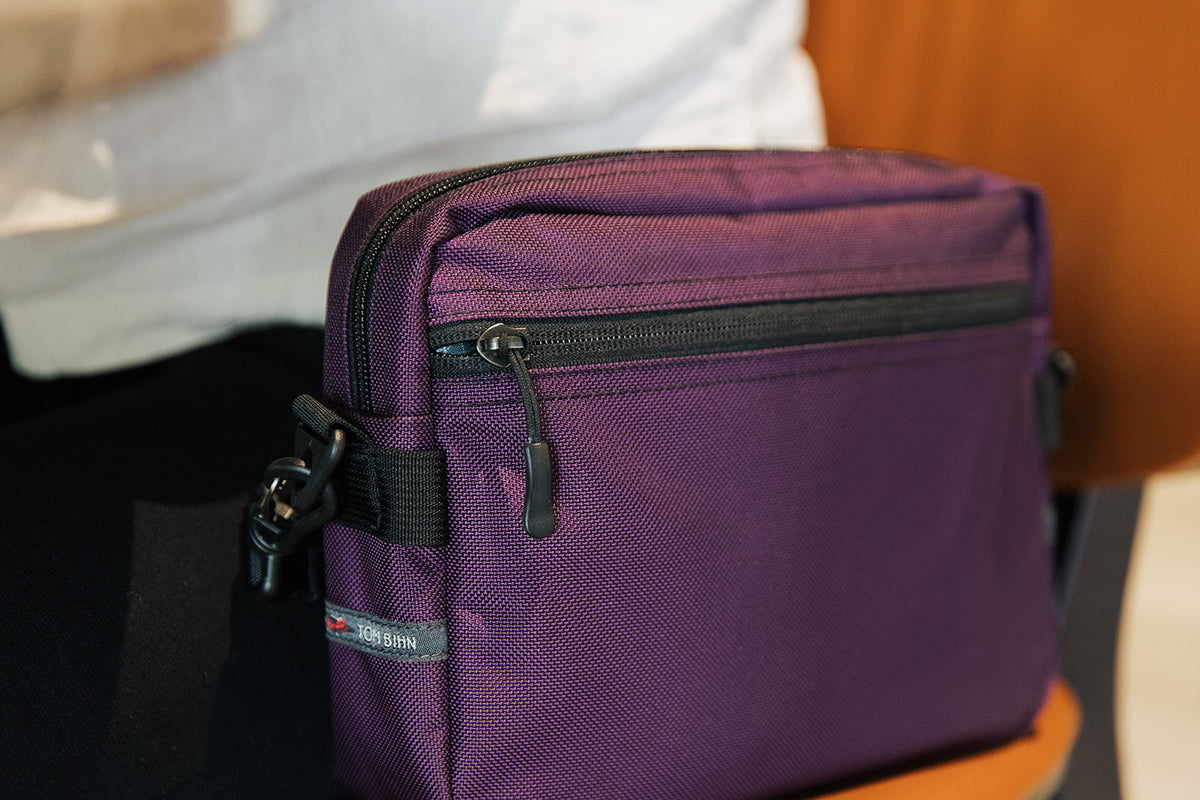 lifestyle visible^^A close up of the front pocket of the Side Kick.