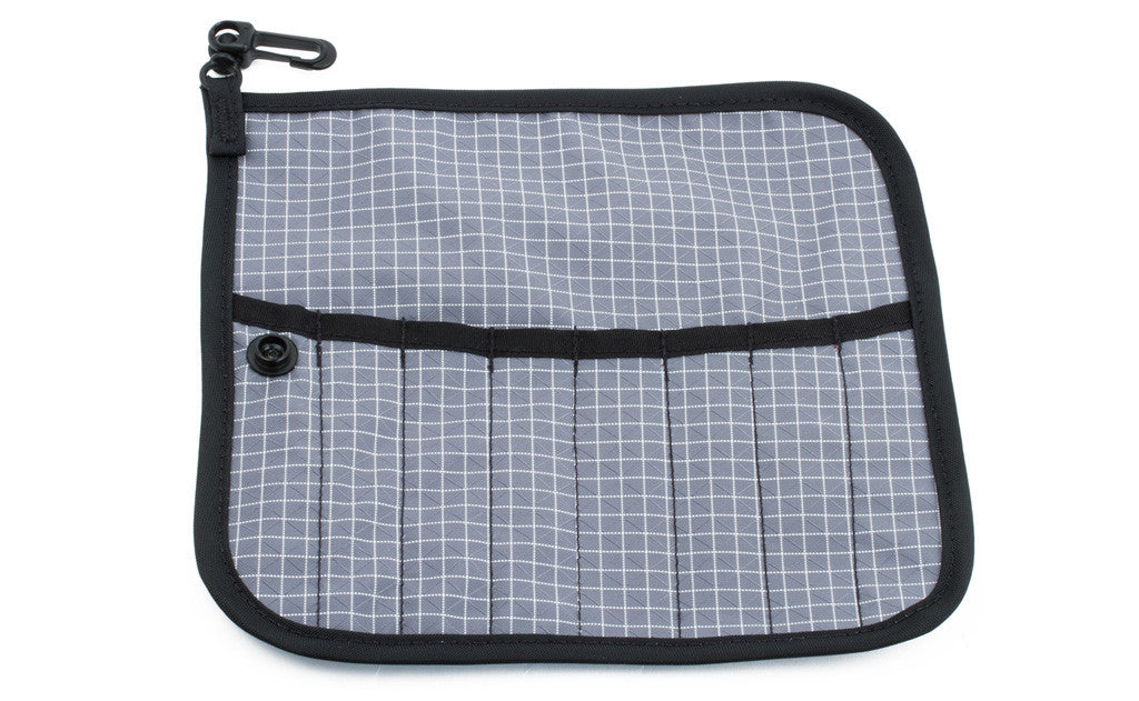 visible variant TB1235-ND^^The front of a Tool Pen Wrap in Northwest Sky (light grey with white grid) 200 Halcyon.