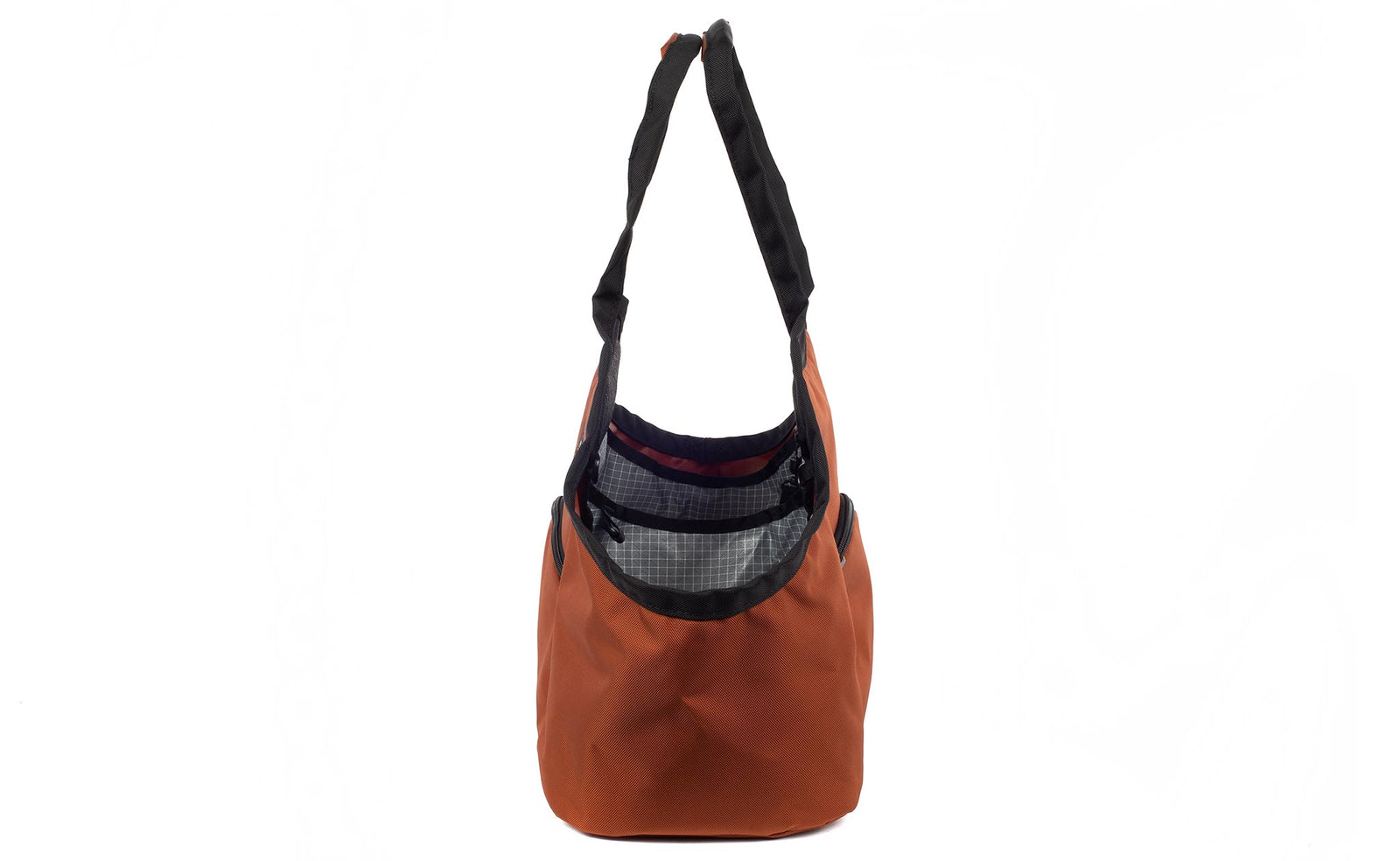 visible variant TB0619-TKND^^The Truckasana in Burnt Orange with Northwest Sky 200d Halcyon lining. Side view of the bag.