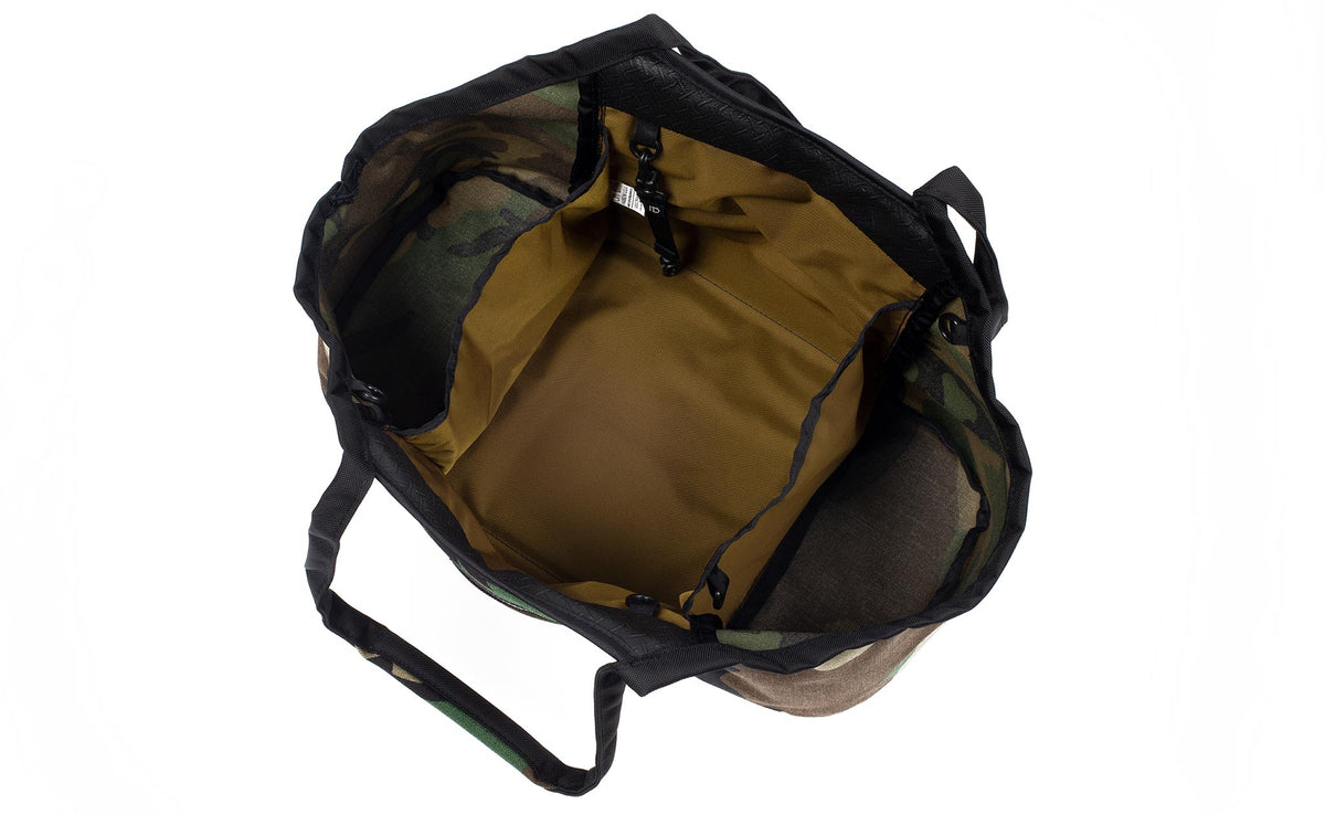 visible variant TB0619-ECCJ^^The Truckasana in Beaver Camo camouflage with Coyote lining. Top-down photo shows the empty three main compartments of the bag.