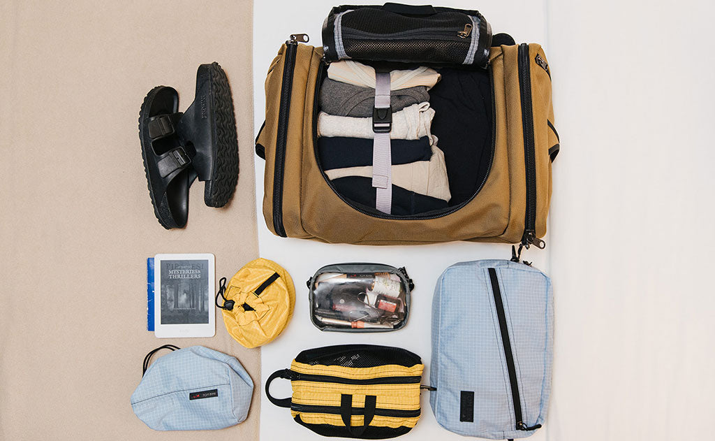 lifestyle visible^^Load out photo showing an Aeronaut 45 in Coyote with a Design Lab Packing Cube Shoulder Bag in Acuity.