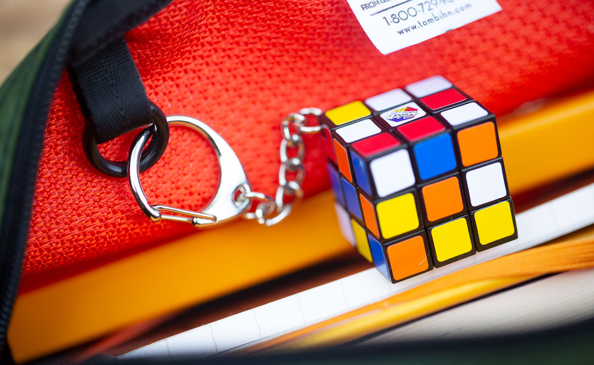 detail visible^^ Close up detail of an o-ring inside a Texturized Orange Grab Bag with a mini Rubik's Cube attached. 