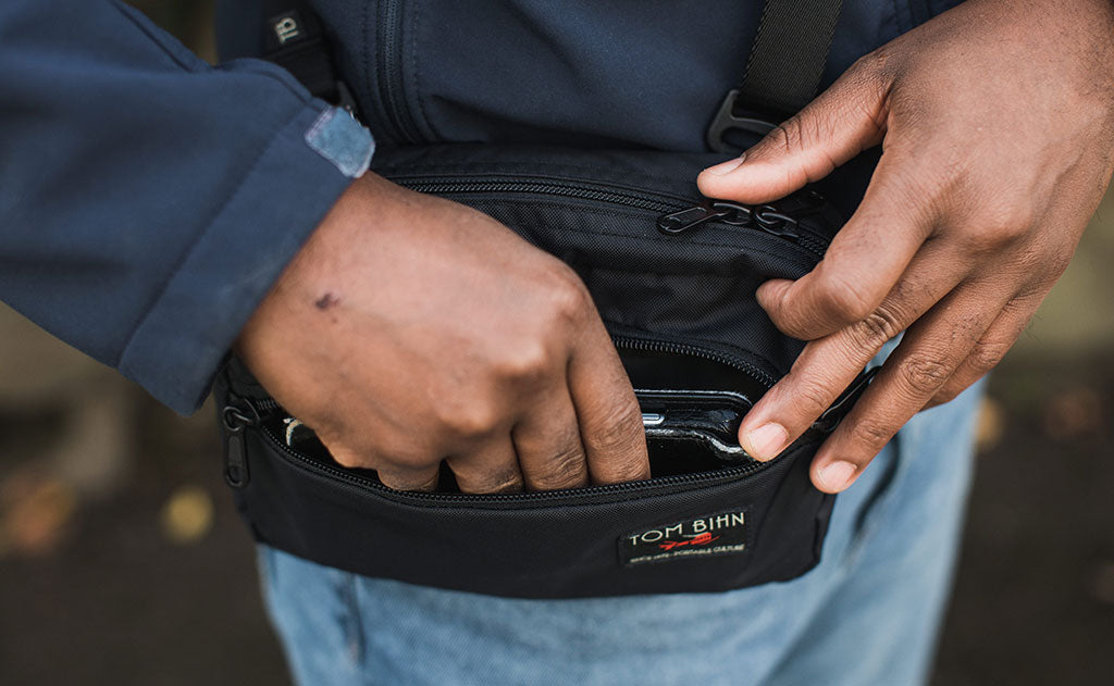 visible lifestyle ^^ A person retrieving their phone from the front pocket of the HLT2.