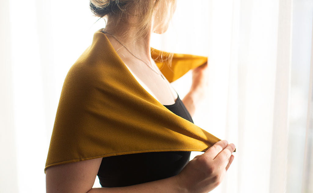lifestyle visible^^A person using the Shepherd's Wool Utility Cloth as a shawl.