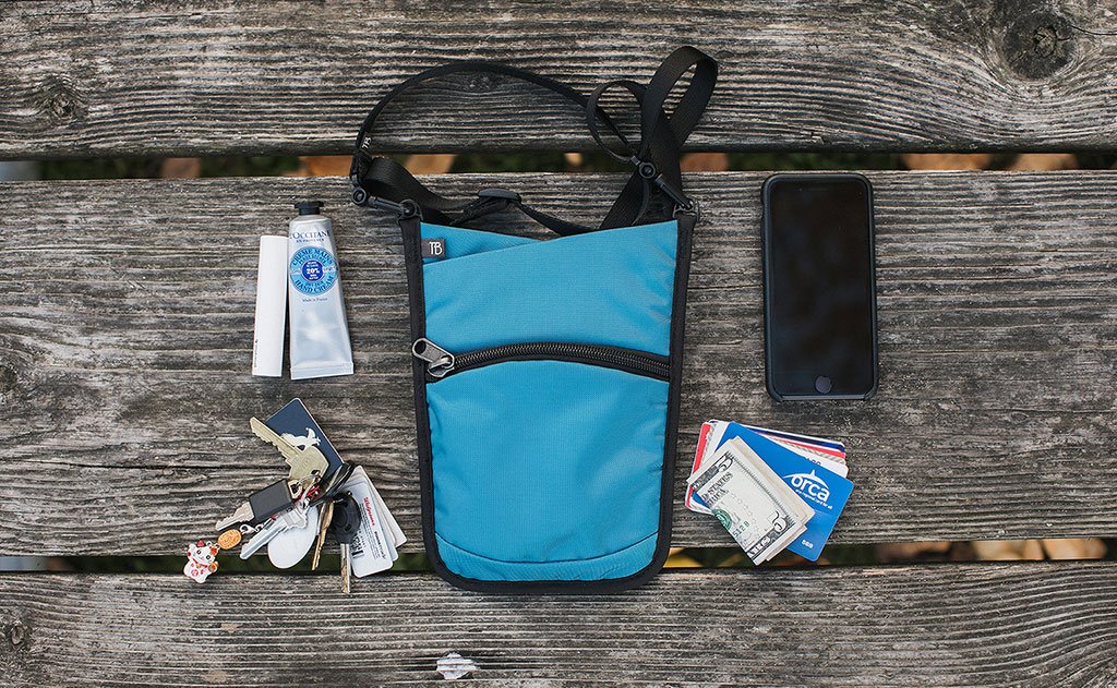 lifestyle visible^^A sample loadout fro the P.I.K.A Pouch (a phone, some cards and cash, a set of keys, chapstick and a tube of lotion).