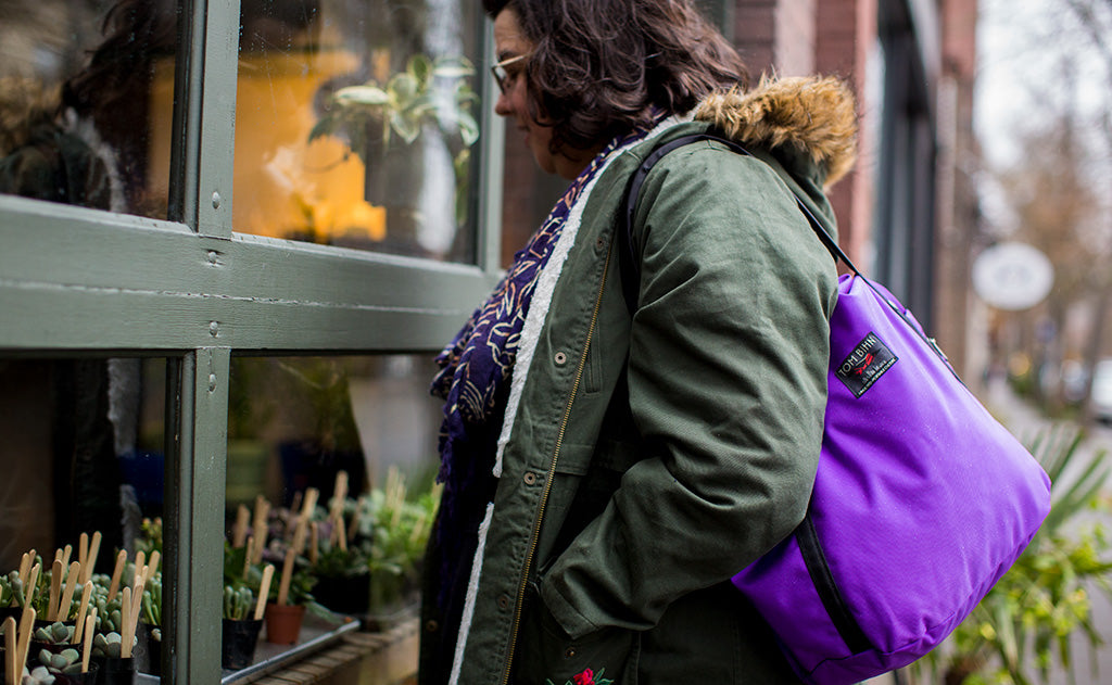 ^^A person carrying the Pop Tote over their shoulder.