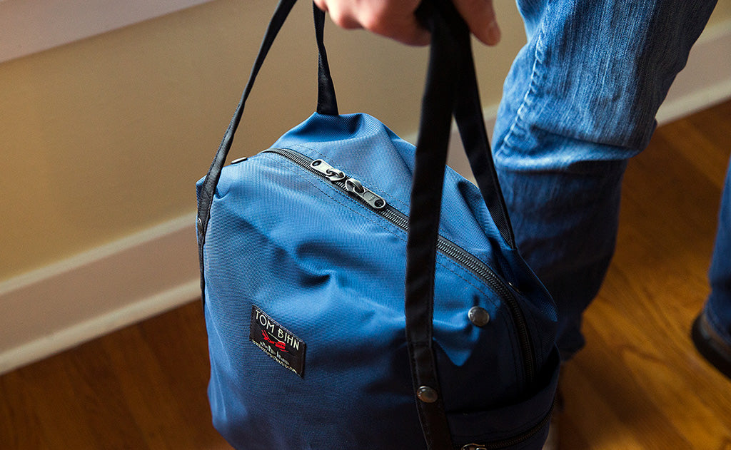 ^^A Pop Tote being carried by the padded carry handles.