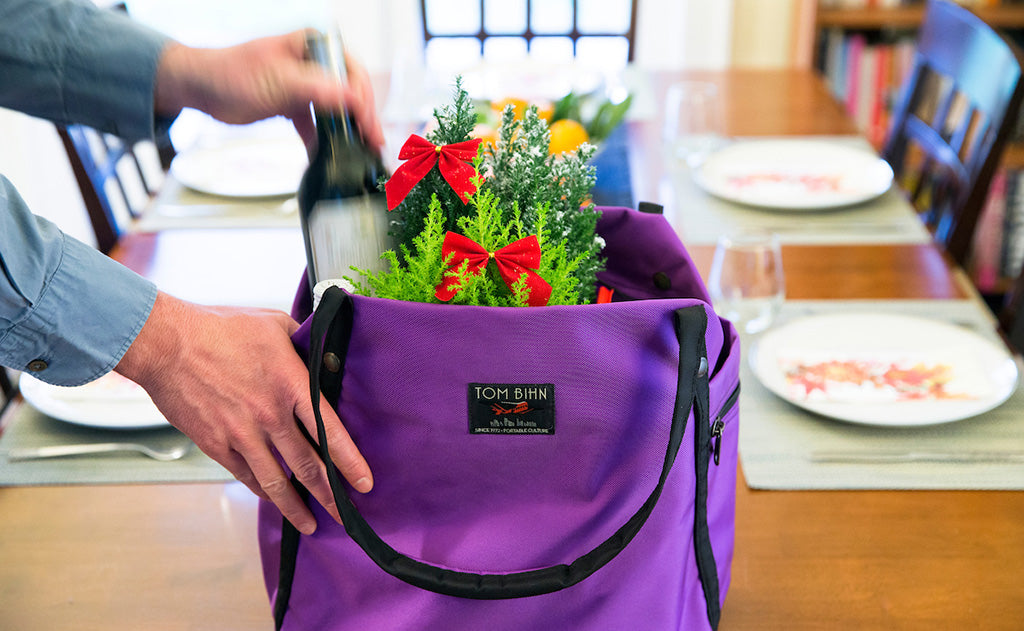 ^^A person grabbing some groceries from Pop Tote.