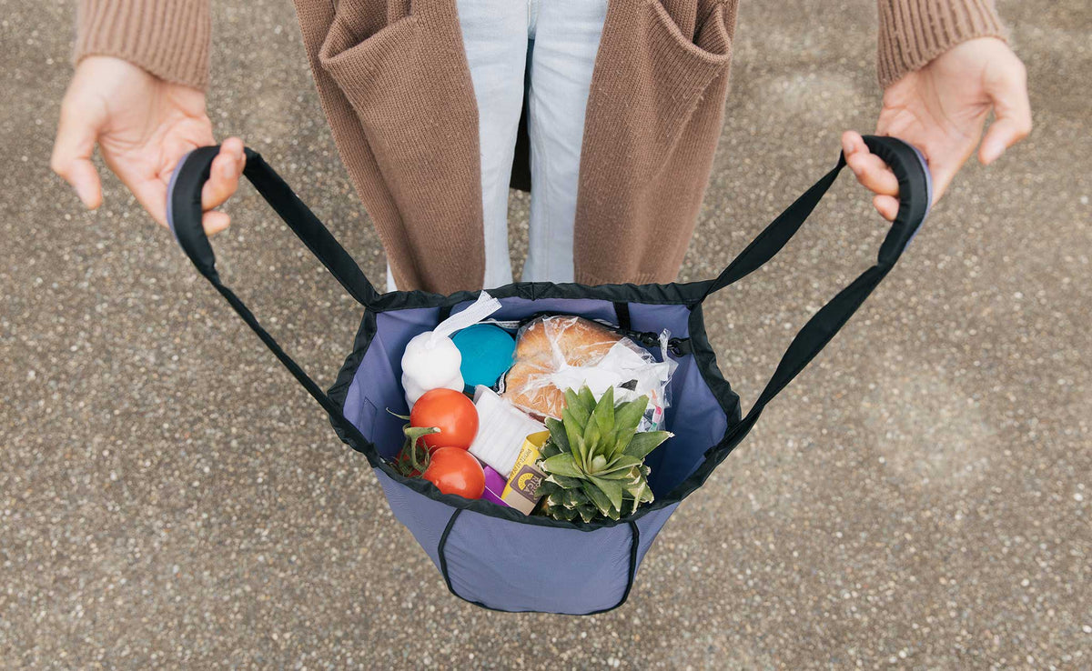 lifestyle visible^^Dawn Shop Bag held open with groceries inside.