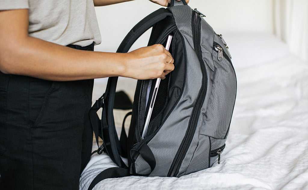 person using laptop pocket