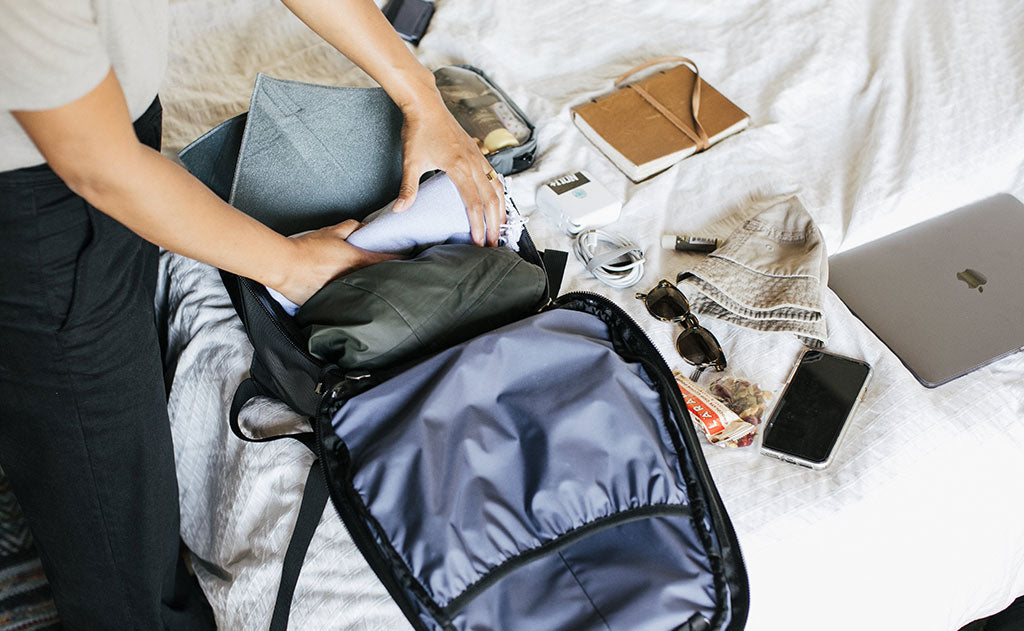 person packing the main compartment