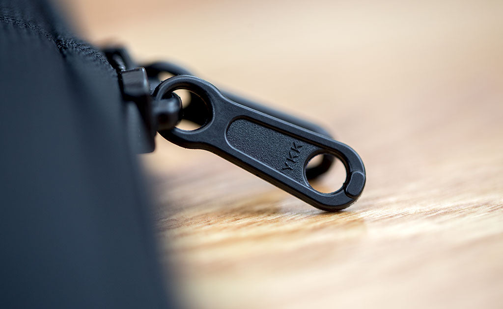 detail visible^^A close shot of the zipper pull tabs.
