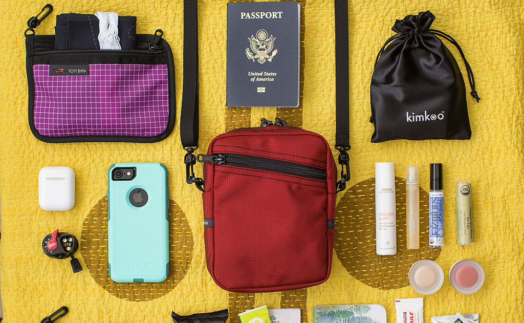 ^^Photo with items around an Everyday Cubelet that might fit inside: passport, phone, make-up, earbuds, headlamp, eye mask.