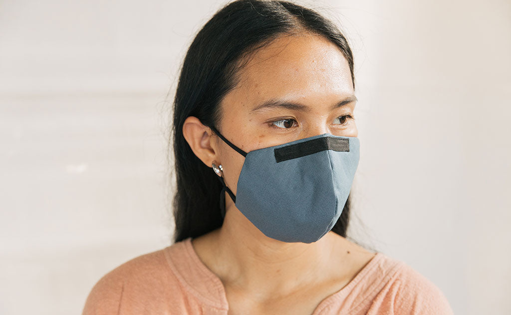 visible variant ME00010-LO^^Person wearing the V5 Mask, Pacific Blue, size Small/Medium.